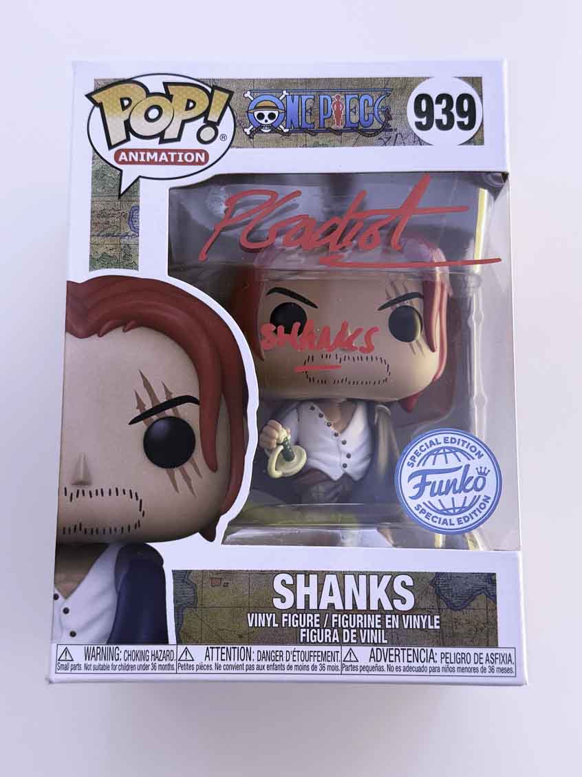Peter Gadiot aka Shanks original autograph with character name on One Piece Funko Pop 939 - red